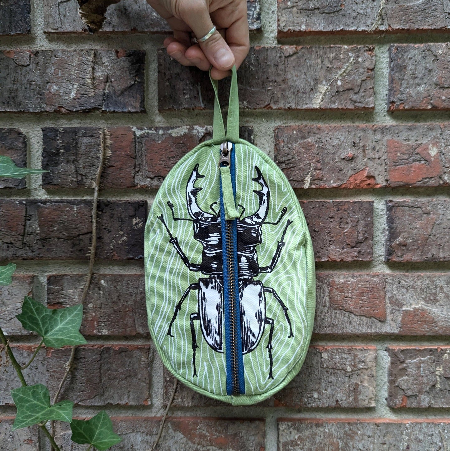 ilikesara | art + goods - Zippered pouch | stag beetle - green insect/bug pencil, supply, makeup bag with waterproof lining