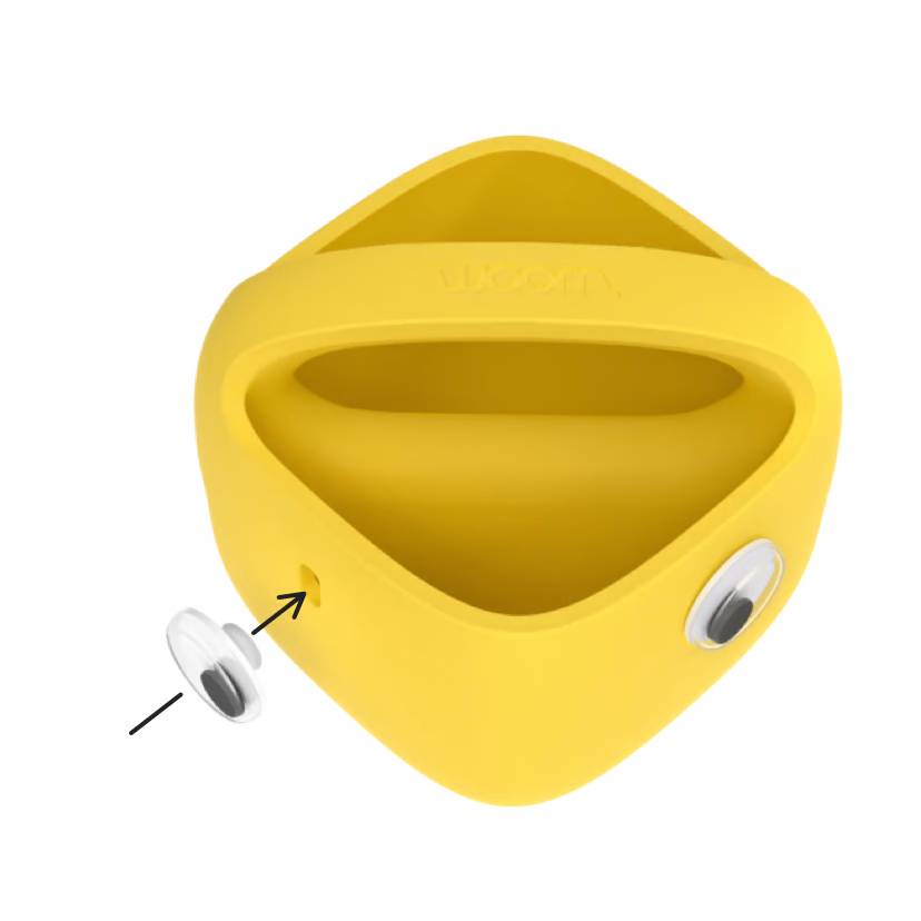 Yellow silicone product with a detachable white component on a white background
