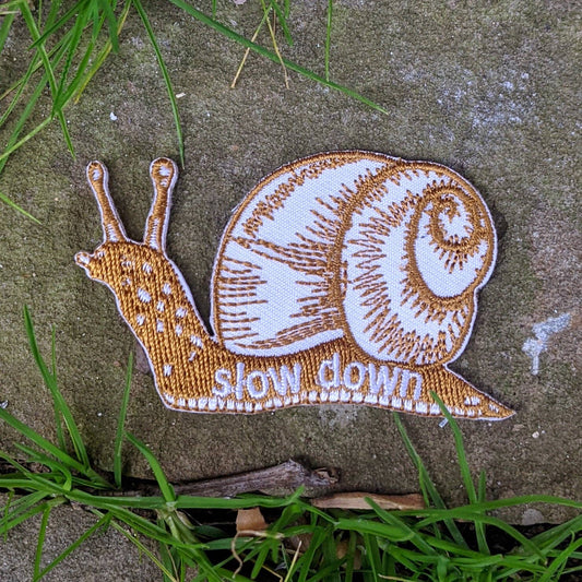 ilikesara | art + goods - Iron-on patch | slow down snail - brown 1.6" x 2.6"