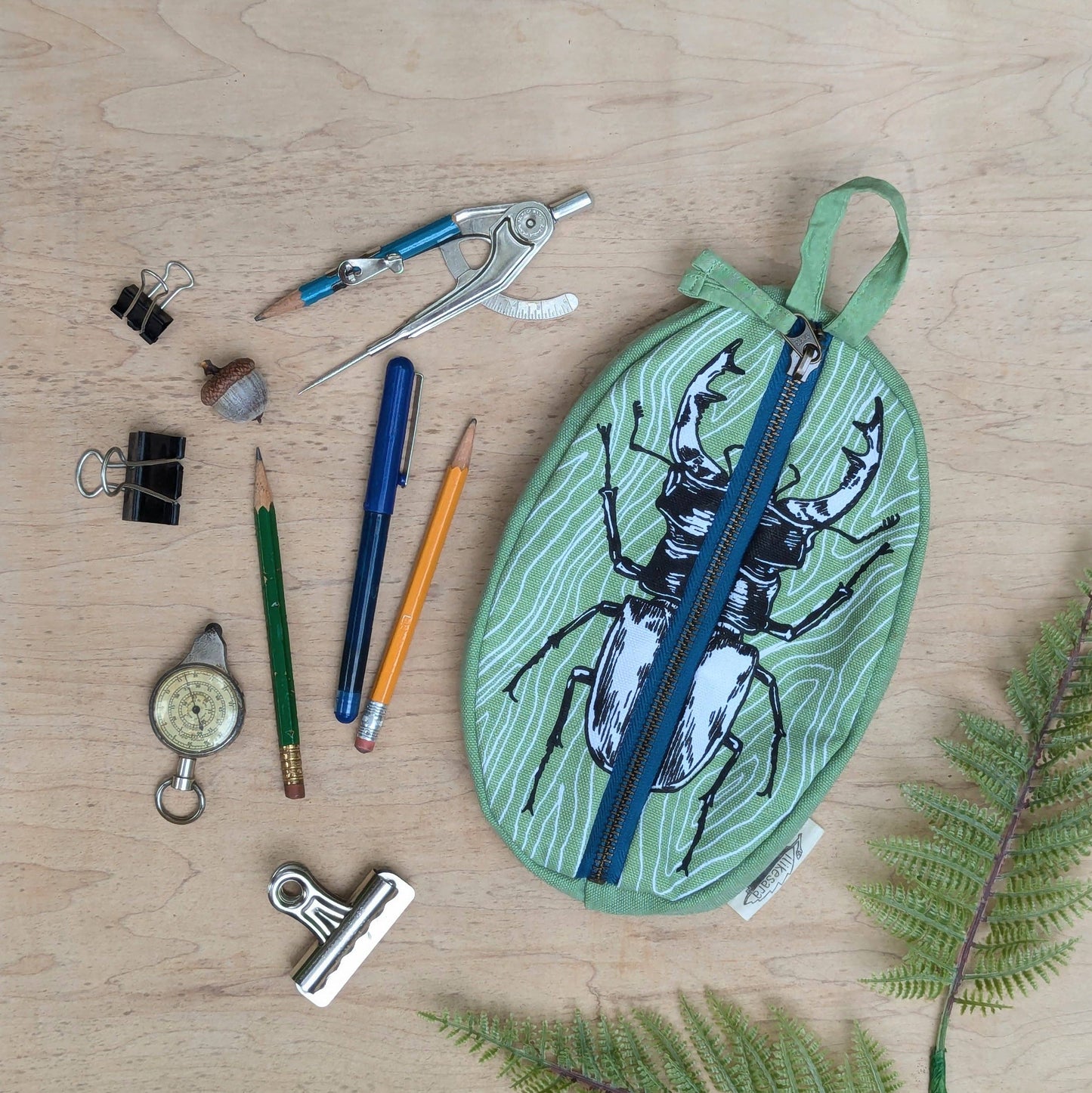 ilikesara | art + goods - Zippered pouch | stag beetle - green insect/bug pencil, supply, makeup bag with waterproof lining
