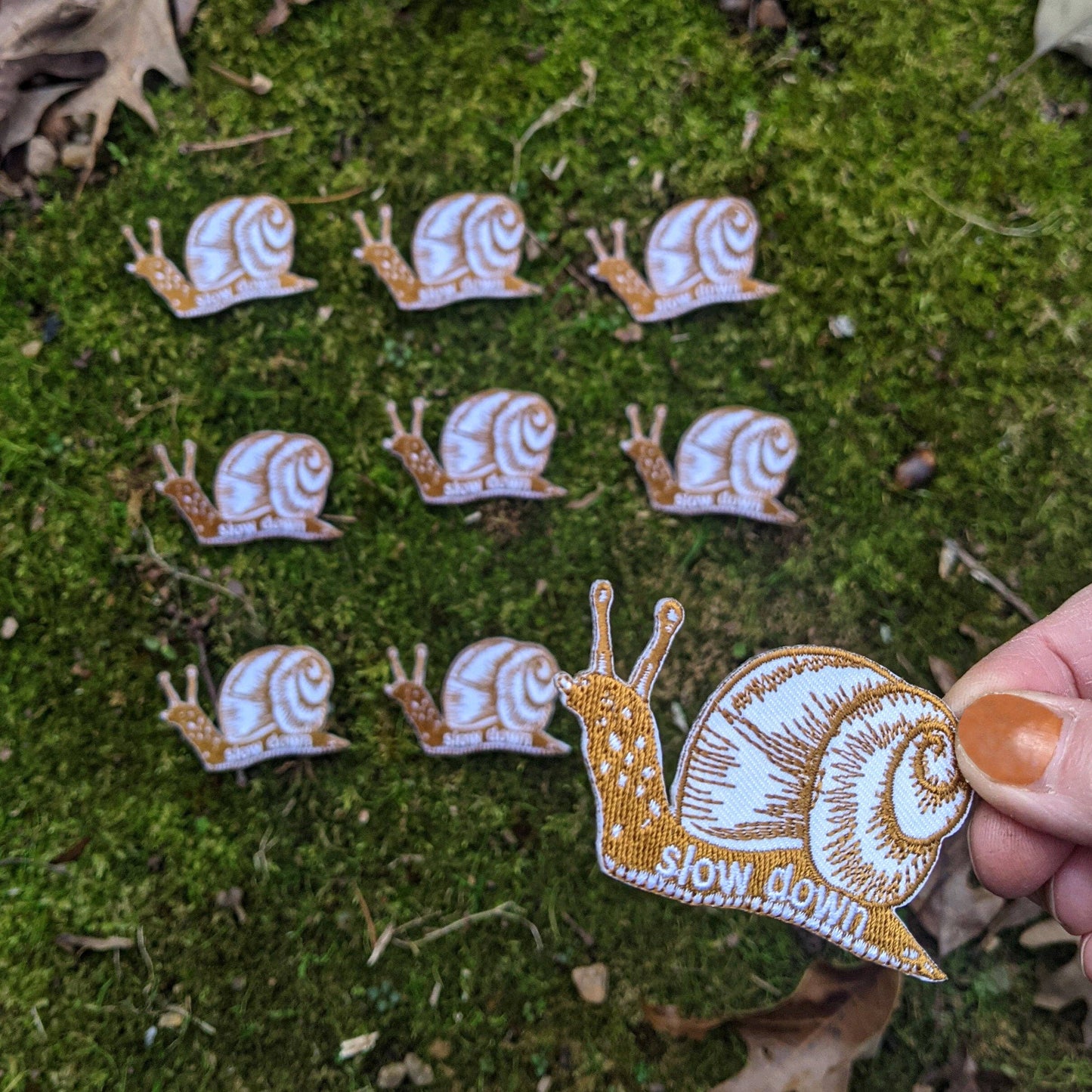 ilikesara | art + goods - Iron-on patch | slow down snail - brown 1.6" x 2.6"