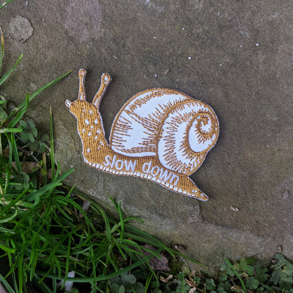 ilikesara | art + goods - Iron-on patch | slow down snail - brown 1.6" x 2.6"