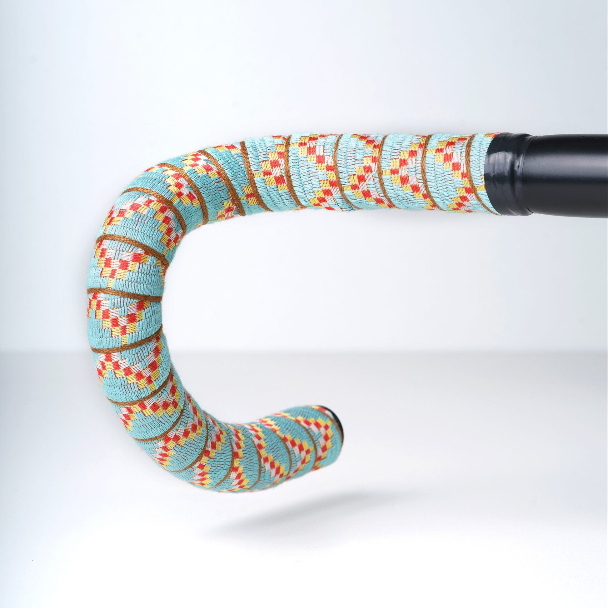 Colorful patterned handlebar on a white background