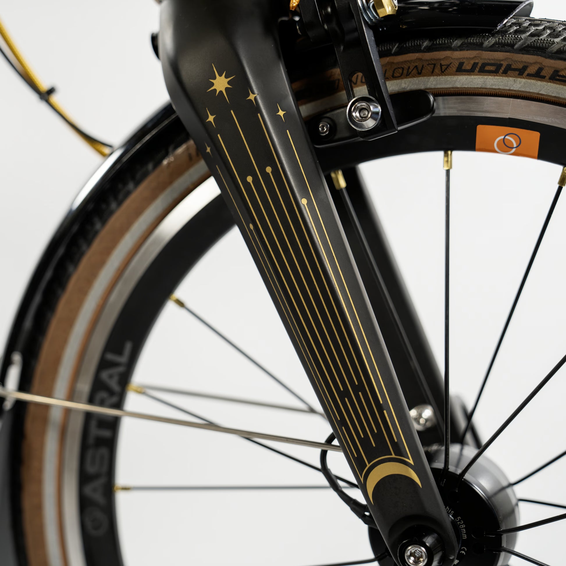 Brompton T Line - Ceratech Black Gold - 12-speed in Ceratech Black Gold