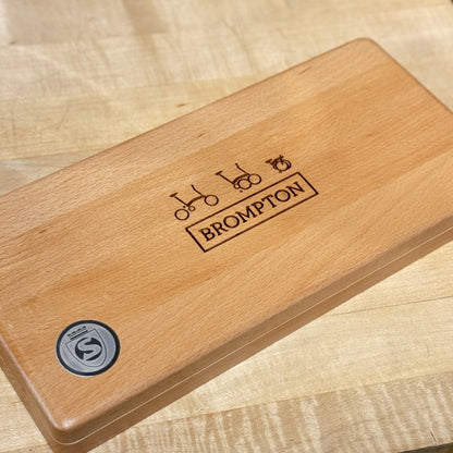 Wooden toolbox with 'Brompton' branding 