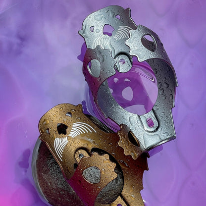 Decorative metal objects on a purple textured background