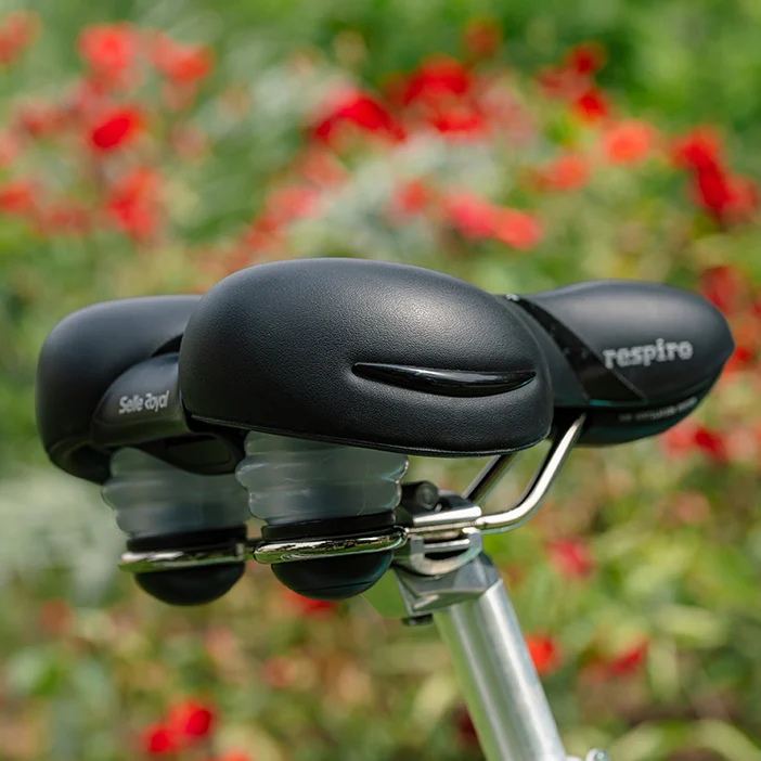 Selle Royal bicycle seat with a blurred floral background