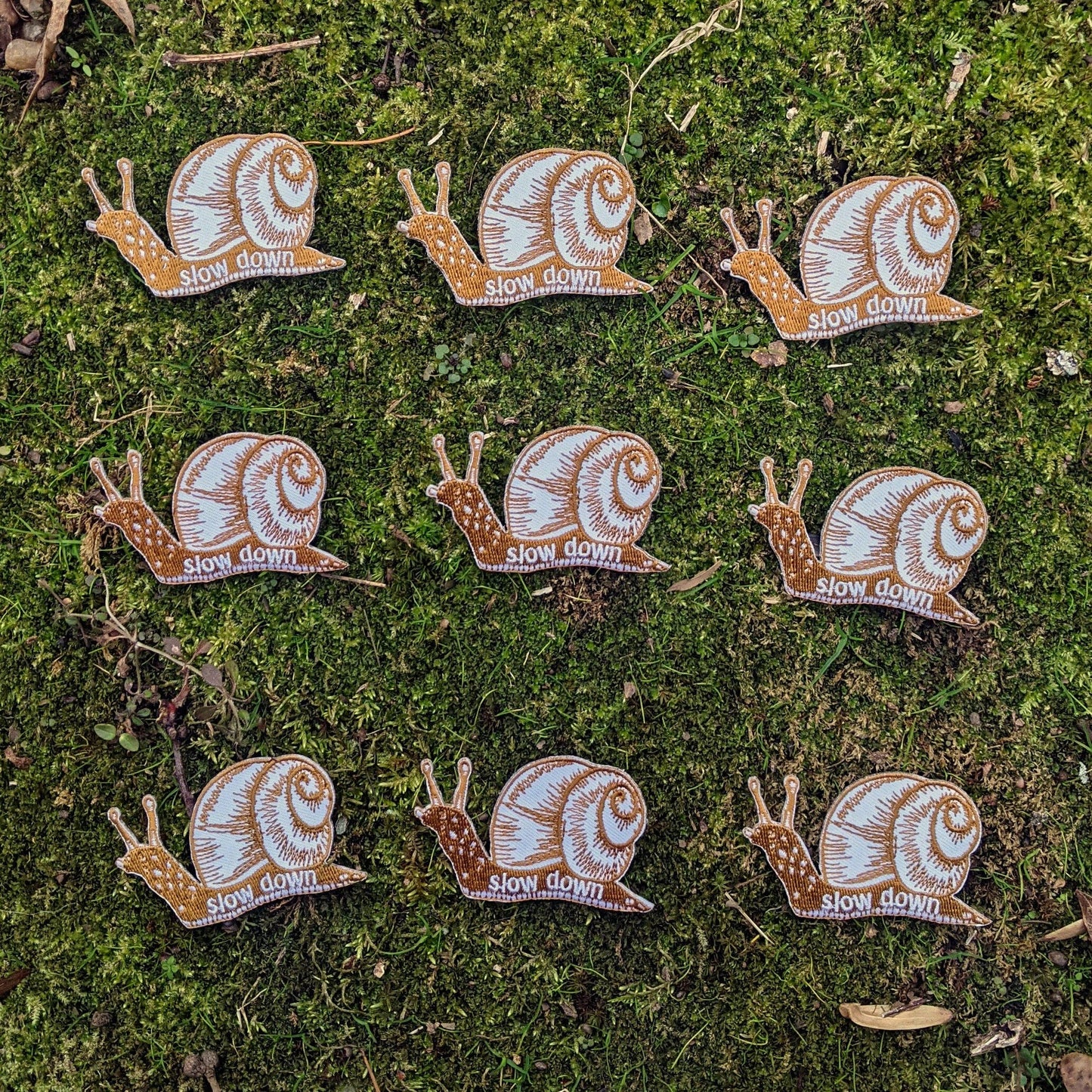ilikesara | art + goods - Iron-on patch | slow down snail - brown 1.6" x 2.6"