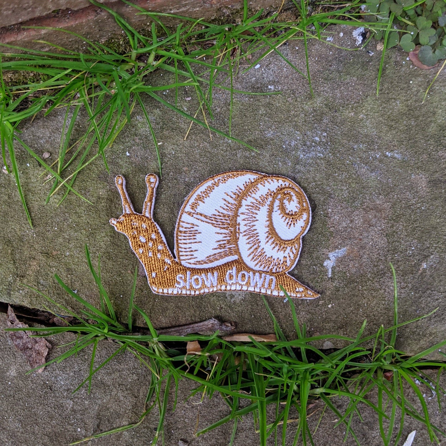 ilikesara | art + goods - Iron-on patch | slow down snail - brown 1.6" x 2.6"