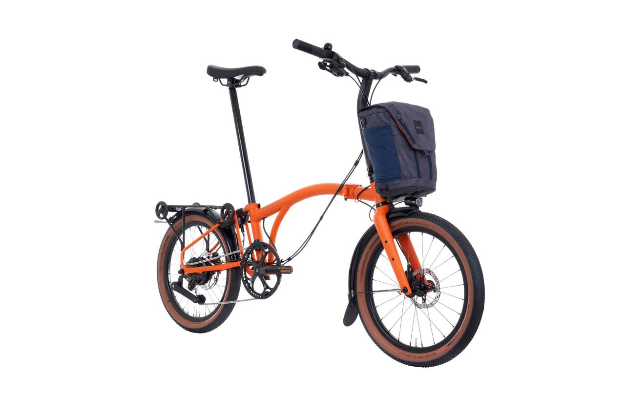 Brompton G Line Electric bike with front battery bag on a white background