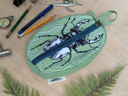ilikesara | art + goods - Zippered pouch | stag beetle - green insect/bug pencil, supply, makeup bag with waterproof lining