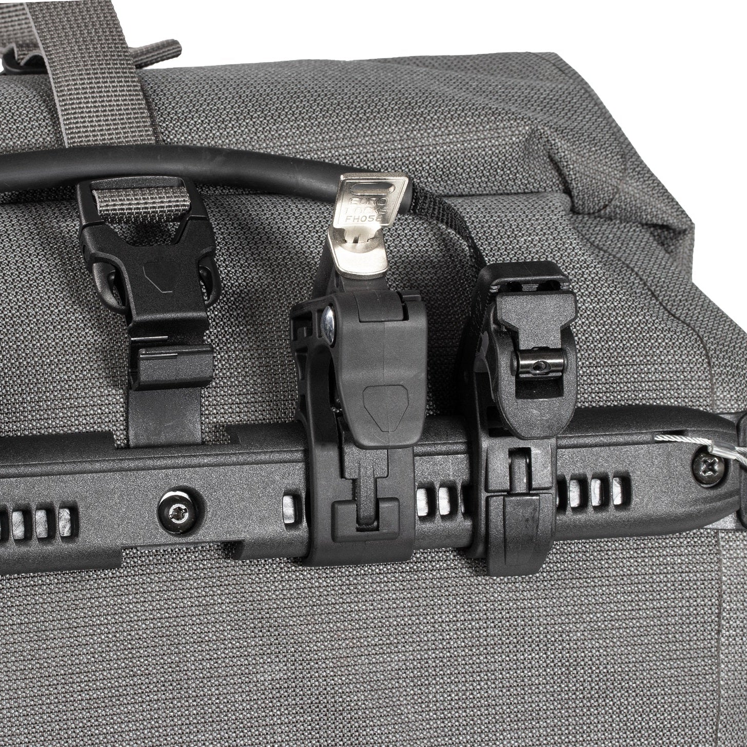 Gray bag with black straps and buckles on a white background