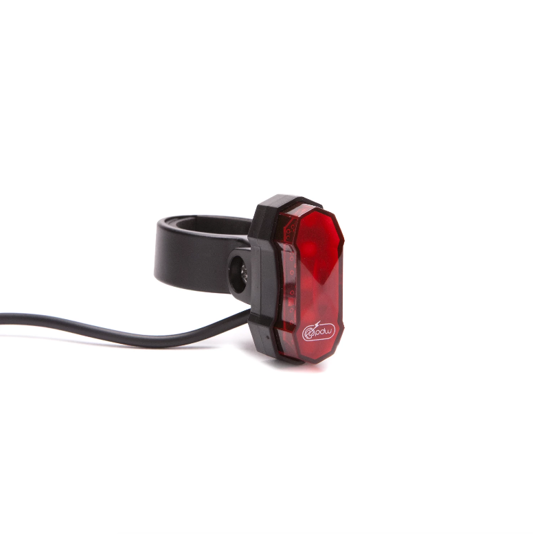 Red bicycle tail light with black mounting bracket on a white background