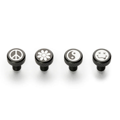 Four black knobs with symbols on a white background