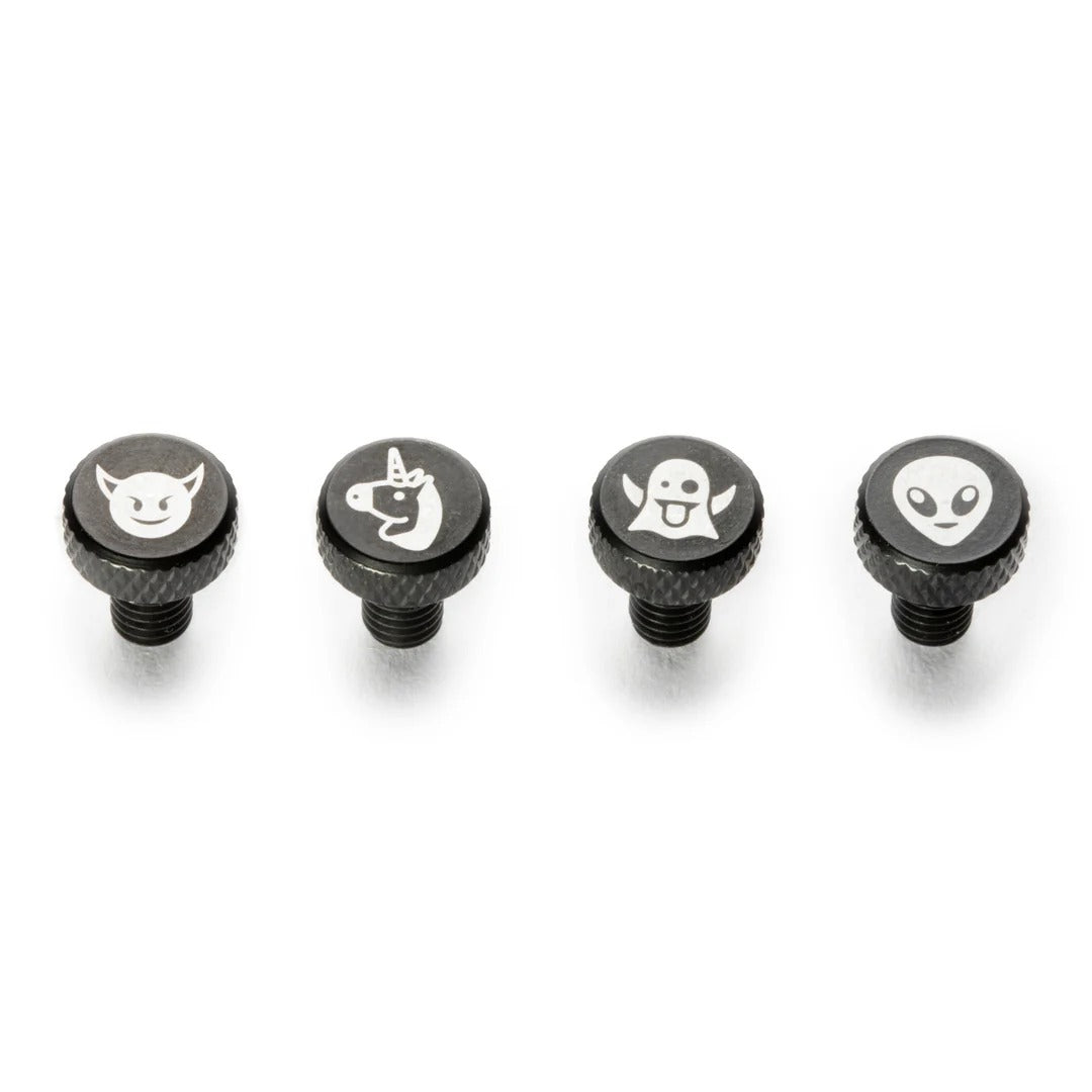 Four black knobs with white symbols on a white background