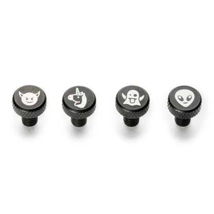 Four black knobs with white symbols on a white background