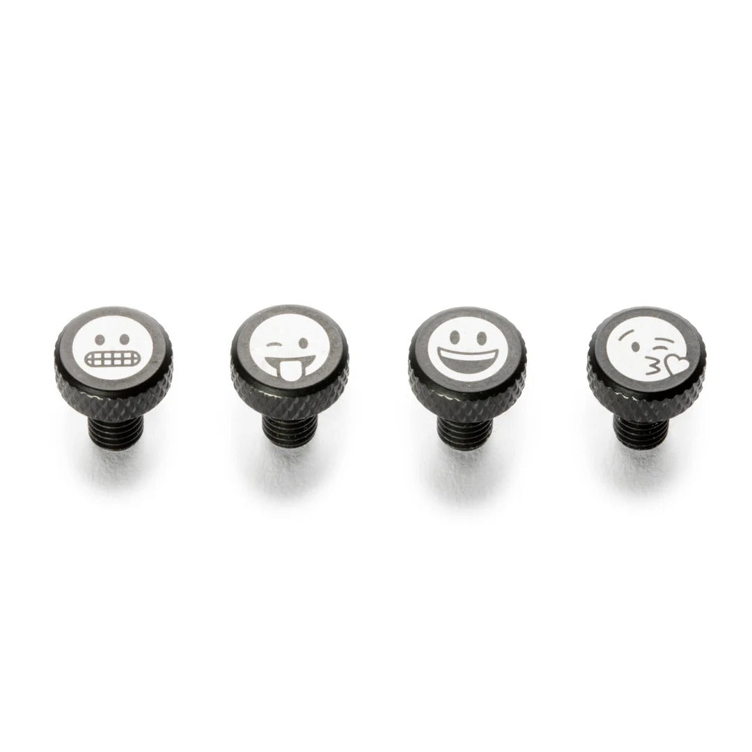 Four black screws with emoji faces on a white background