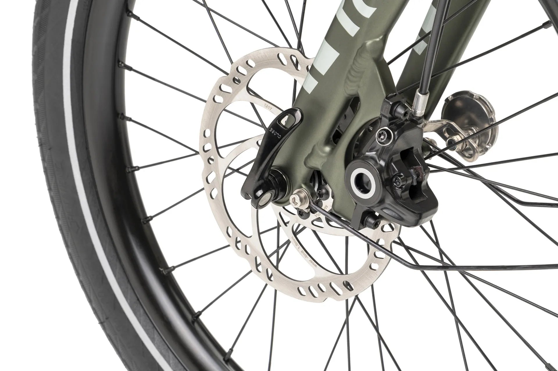 Close-up of a bicycle wheel with disc brake system on a white background