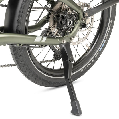 Close-up of a bicycle wheel with a kickstand on a white background